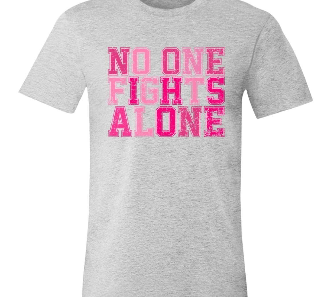light heather grey short sleeve t-shirt with block letters in pink that say, "No one fights alone".