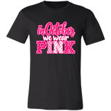 a black graphic t-shirt that reads 'in October we wear PINK' in pink and white lettering