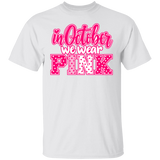 white tshirt with the words, "in October we wear Pink" with the letters in pink and white polka dots.