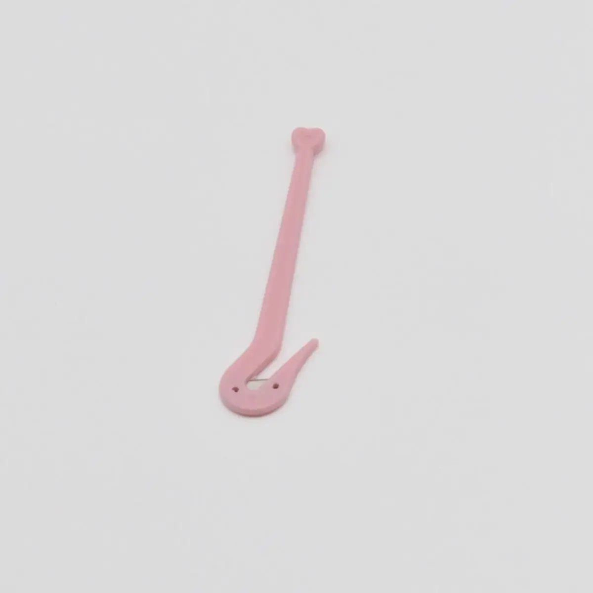 A small handheld medical wristband cutter, a safety tool for removing a hospital ID band after an appointment or surgery.